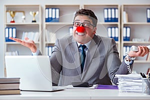 Clown businessman working in the office