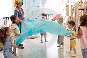 Clown at children birthday party entertaining preschool kids