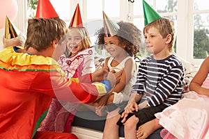 Clown entertaining children