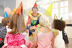 Clown entertaining children at party