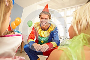 Clown entertaining children at party