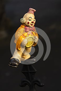 Clown figure as a toy with a sad and melancholy expression almost scary, scary look