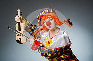 Clown in funny concept on dark background