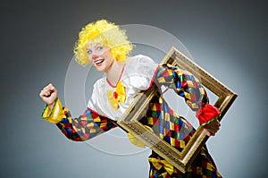 Clown in funny concept on dark background