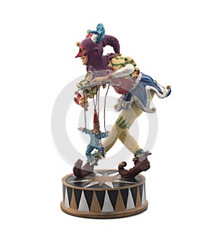 Clown with maces made of ceramics on a white background.