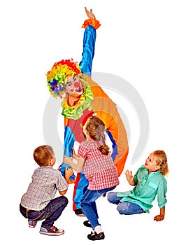 Clown playing on birthday with group children