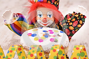 Clown with red hairs and sweet donut