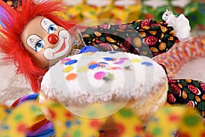 Clown with red hairs and sweet donut