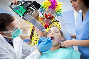 Clown threaten girl with chainsaw in dental ambulant
