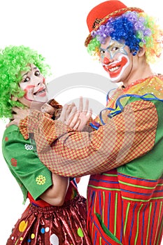 Clown tries to strangle a female clown photo