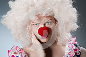Clown with white wig against