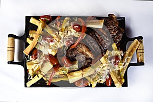 Club Beef steak with pepper sauce and Grilled vegetables on cutting board on dark wooden background