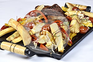 Club Beef steak with pepper sauce and Grilled vegetables on cutting board on dark wooden background