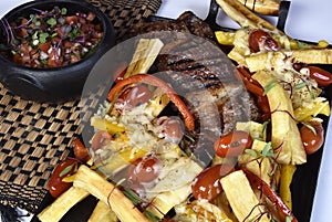 Club Beef steak with pepper sauce and Grilled vegetables on cutting board on dark wooden background