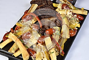 Club Beef steak with pepper sauce and Grilled vegetables on cutting board on white wooden background