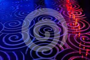 Club dance floor interior. spiral tile background whith bokeh reflection