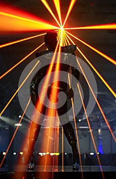Club dancer against laser rays