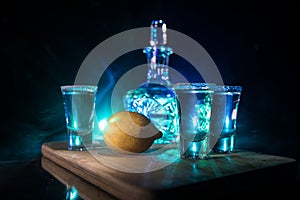 Club drink concept. Tasty alcohol drink cocktail tequila with lime and salt on vibrant dark background or glasses with tequila at