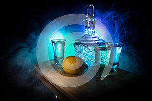 Club drink concept. Tasty alcohol drink cocktail tequila with lime and salt on vibrant dark background or glasses with tequila at