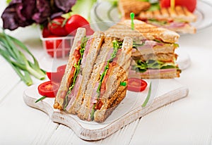 Club sandwich - panini with ham, cheese, tomato