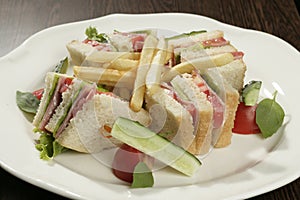 Club sandwich with tomatoe ham and lettuse