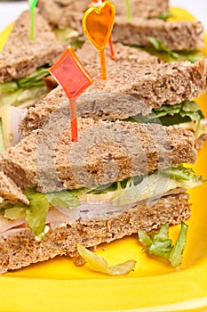 Club sandwiches with ham and cheese,