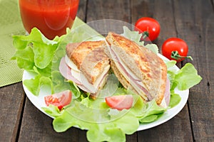 Club sandwiches on plate on wooden table