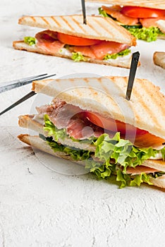 Club sandwiches with salmon