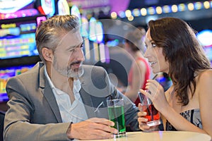 Clubbing couple with drinks