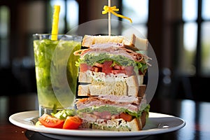 clubhouse sandwich miraculously balanced on a tall water glass