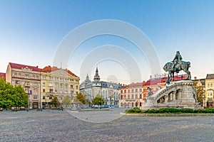 Cluj-Napoca city center. View from the Unirii Square to the Rhedey Palace, Matthias Corvinus Monument and New York Hotel at