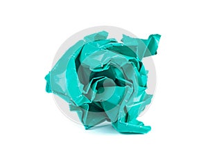 Clump of crumpled turquoise paper on a white