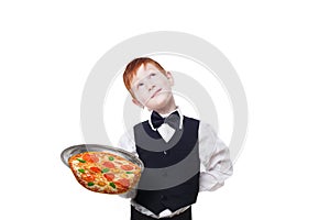 Clumsy inattentive little waiter drops pizza from tray