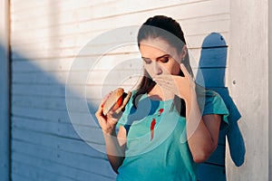 Clumsy Woman Staining Her Shirt with Ketchup Sauce