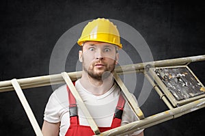 Clumsy worker with ladder photo