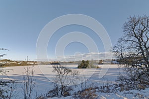 Clunie Island set on the edge of a frozen Clunie Loch one evening on a cold winters day in January,