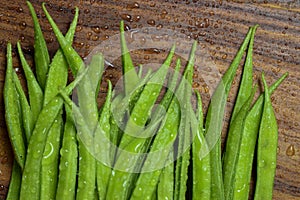 Cluster Bean or  GuarAlso Known as Gavar, Guwar or Guvar Bean isolated on Wooden Background photo