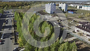 Cluster of high-rise structures with expressway and lush garden