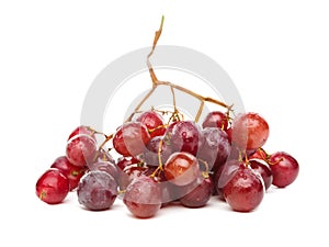 A cluster of red grapes isolated on white background