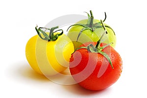 Cluster of red yellow and green tomatoes