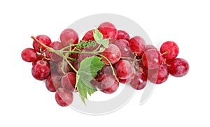 Cluster of ripe red grapes with green leaves on white background, top view