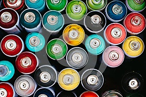 Cluster of spray paint cans, from abve