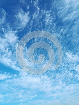 Clusters of high-altitude cirrus cumulus clouds in April