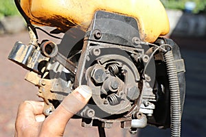 Clutch system of a brush cutter or grass cutter machine. View of petrol brush cutting engine inside parts