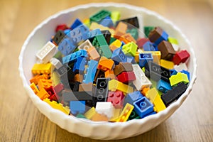 Cluttered pile of colorful toy construction bricks