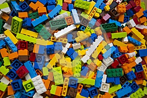 Cluttered pile of colorful toy construction bricks