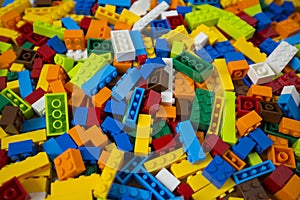 Cluttered pile of colorful toy construction bricks