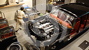 Cmc 1 18 scale model car - garage diorama of a Mercedes Benz S600 Pullman limousine in repairs