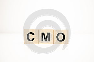 cmo concept on wooden cubes. Business concept