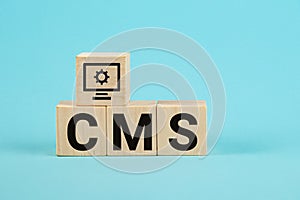 CMS acronym on woodblock cubes blue background, Frequently asked questions, Business customer service, and support